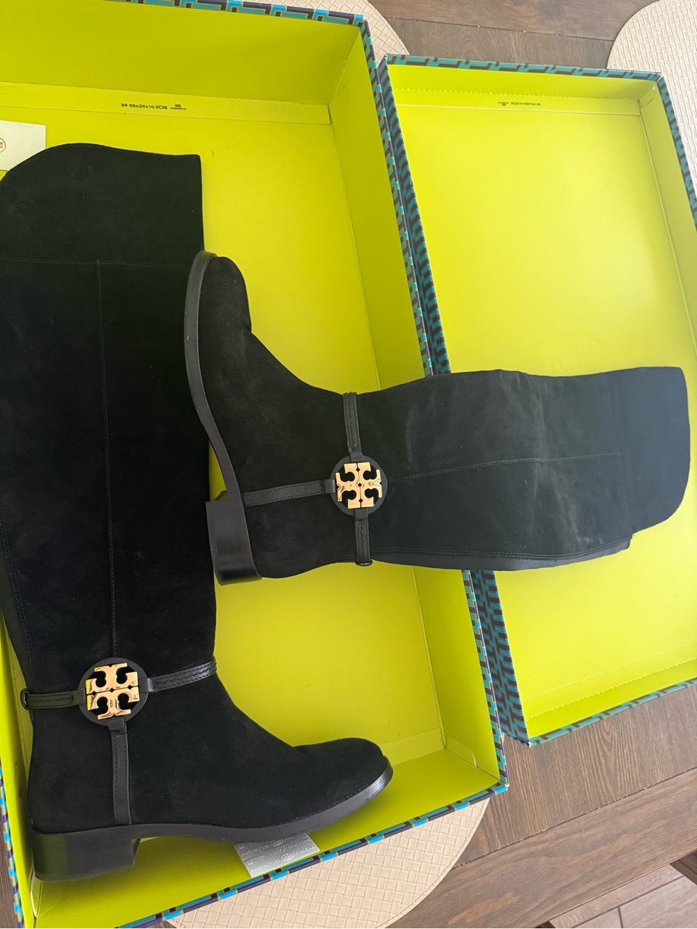 Knee-high black suede boots